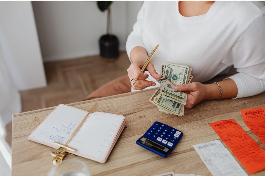 stay at home mom reviewing spending to fund her soft life