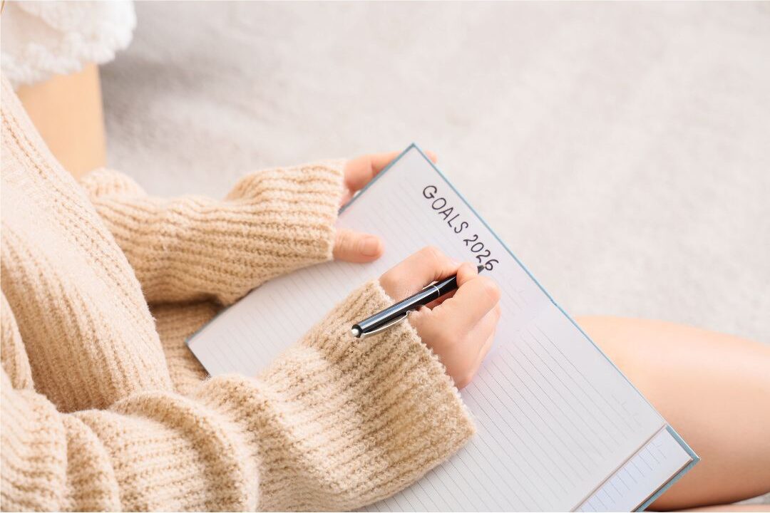 stay at home mom writing her goals affirming that her dreams are still valid