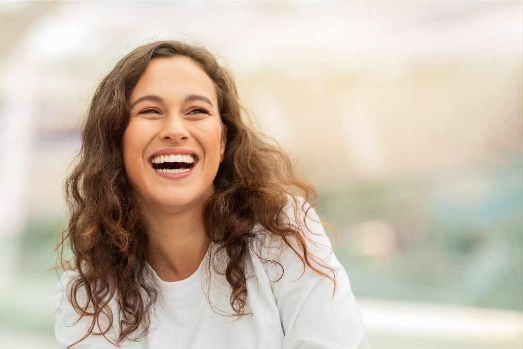 stay at home mom laughing genuinely affirming she deserves to enjoy her life