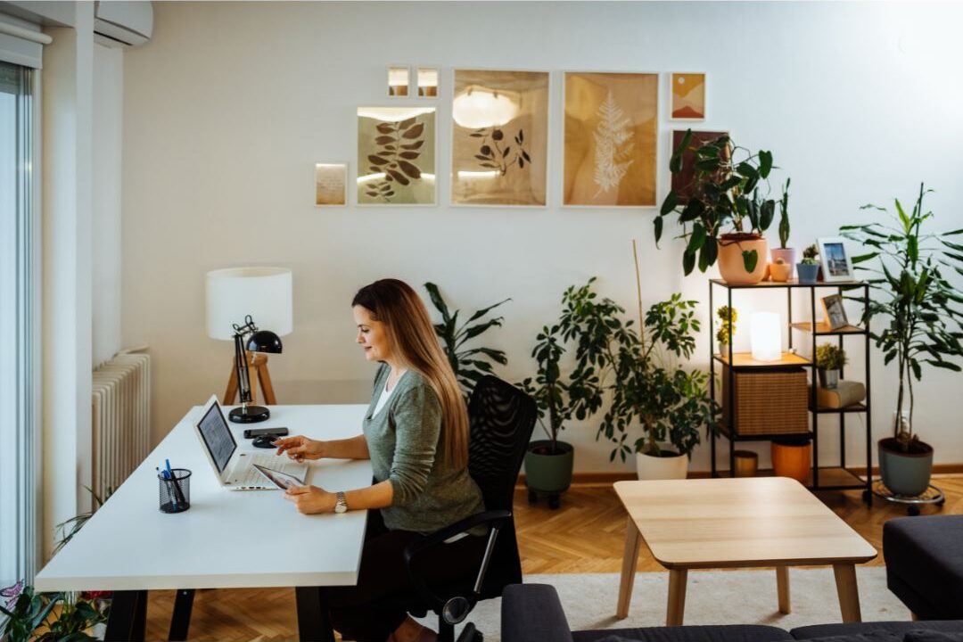 woman sitting in her beautiful work from home space
