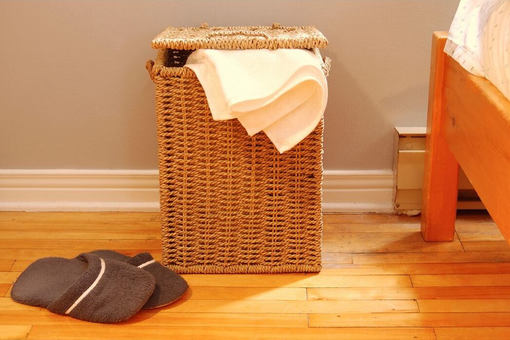 keeping a laundry hamper in every bedroom for neatness