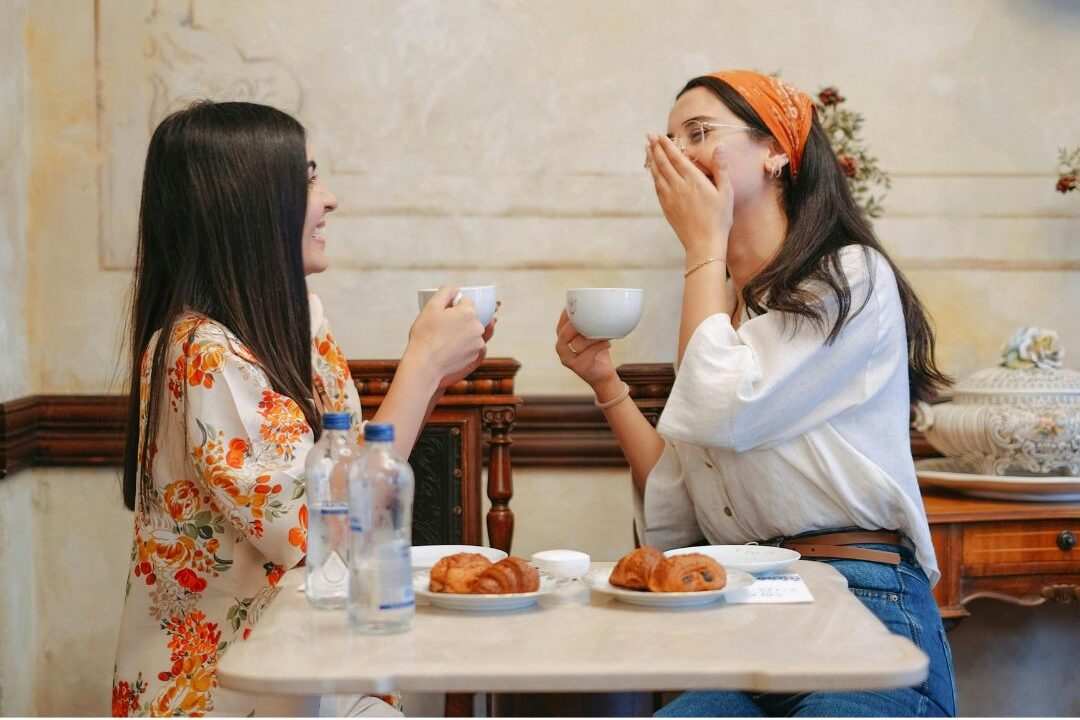 women connecting and laughing as a free self care connection habit