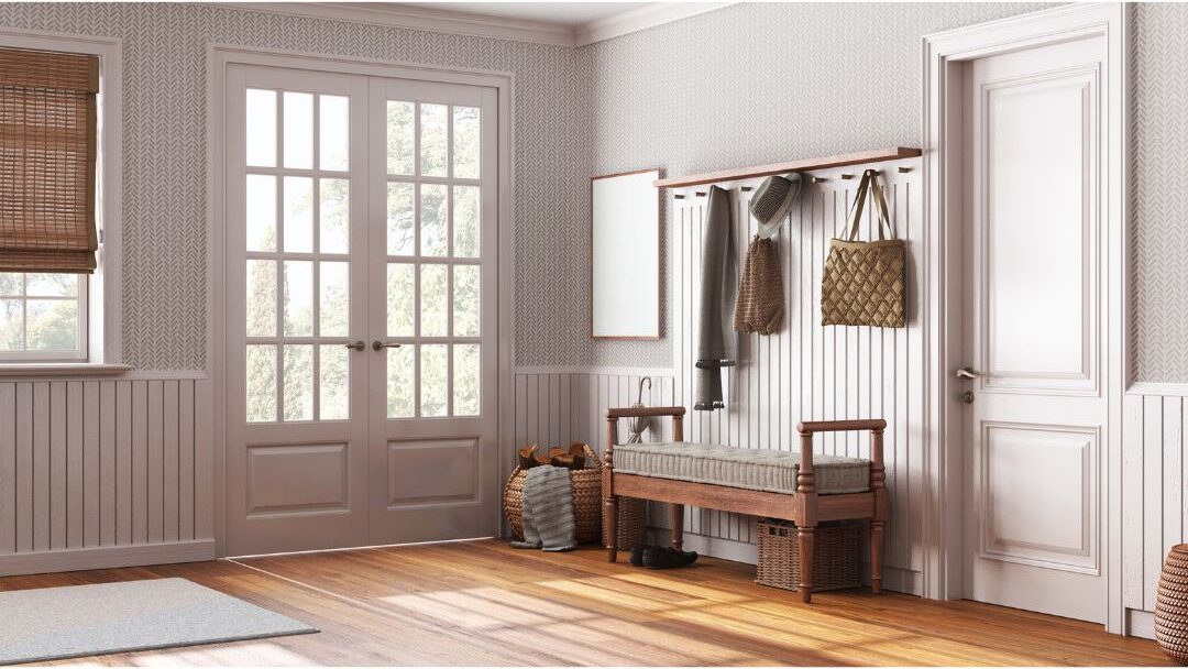 an organized entryway landing zone with hooks and baskets for keys and bags