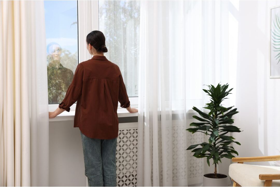 a mother closing her laptop to set emotional boundaries and protect her personal res