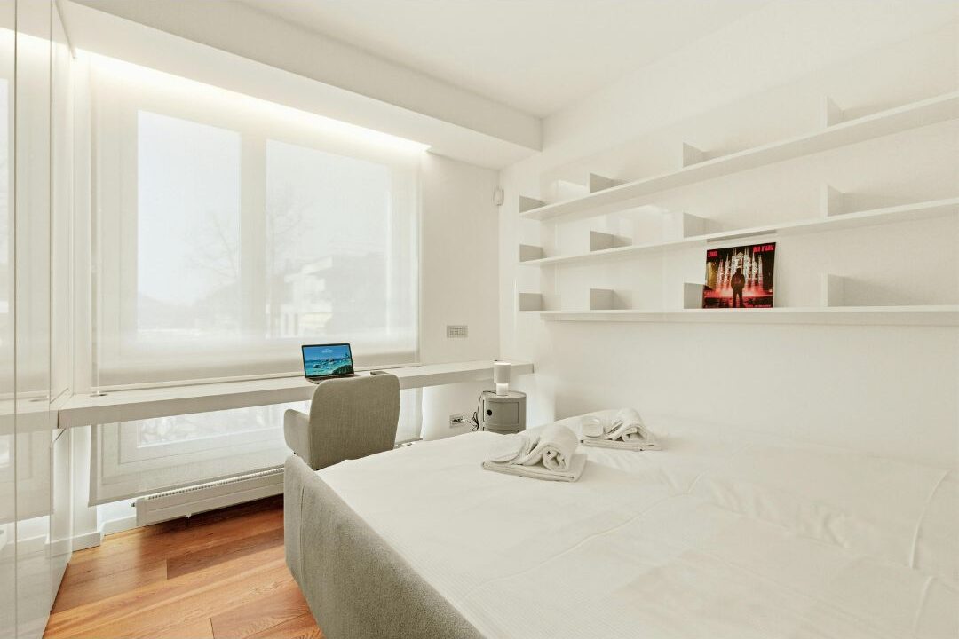 floating shelves above a desk in a bedroom small home office for moms