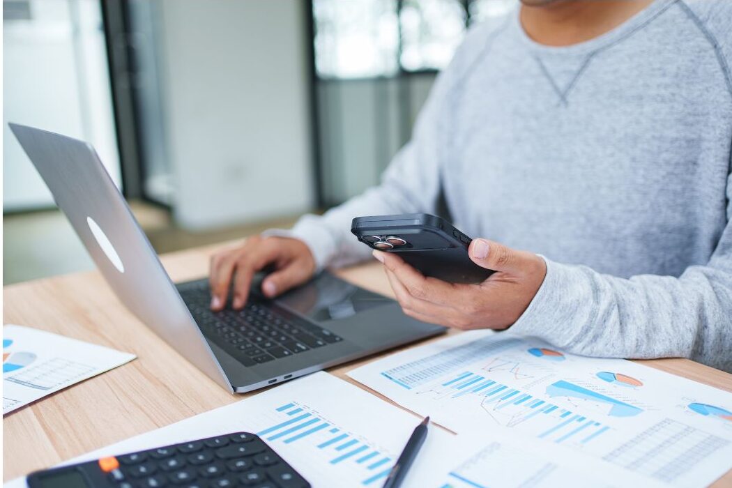 reviewing bank statement to cancel forgotten app subscriptions keeping you broke