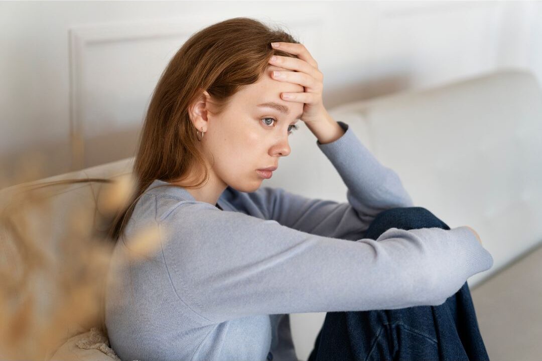 woman holding onto unspoken resentment one of the habits secretly keeping her stressed