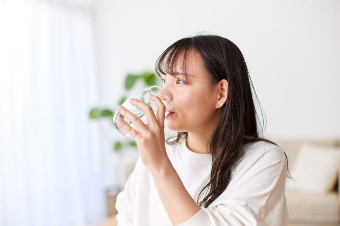 woman staying hydrated as part of her free physical self care routine