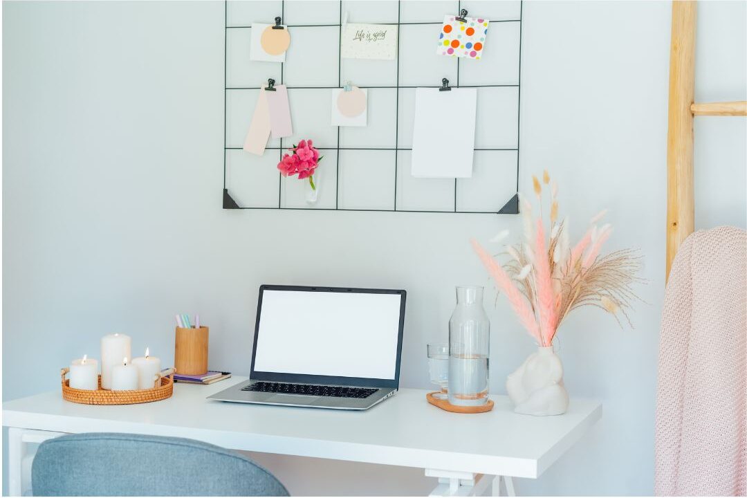 wire grid inspiration board hung above a desk for daily motivation