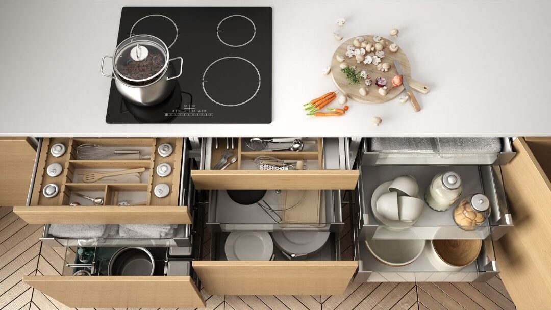 organized kitchen spice drawer inside a well mapped cooking zone