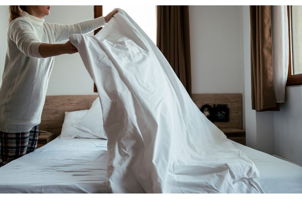 making the bed without airing it first as a cleaning mistake that makes your house dirtier