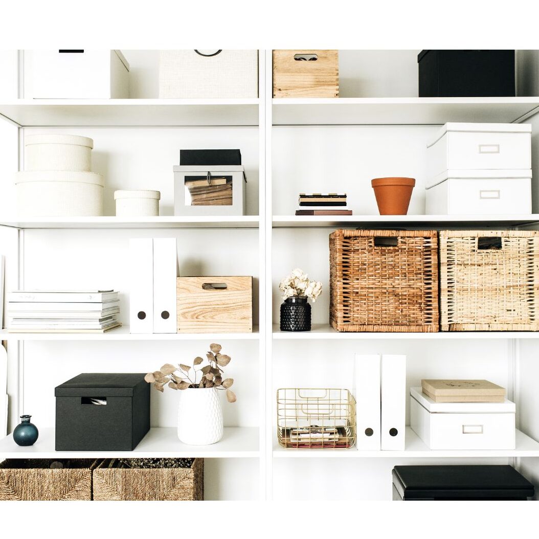 matching storage boxes on shelves to hide work supplies in a shared room