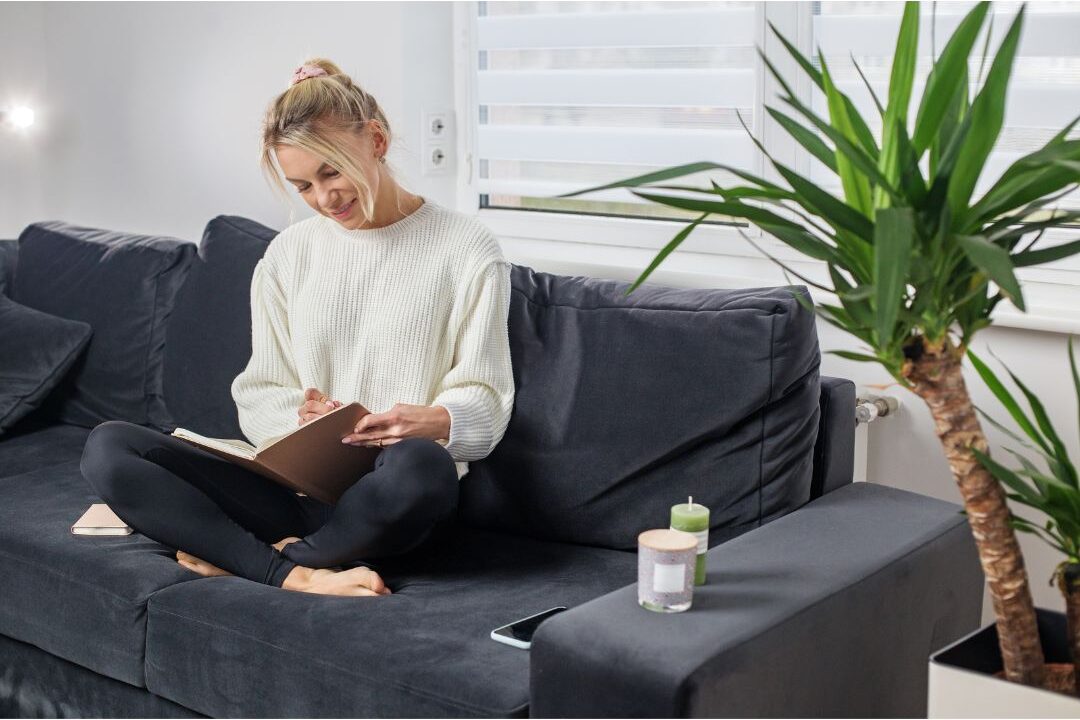 woman journaling her home vision as the fix for never deciding what kind of home she wants to live in