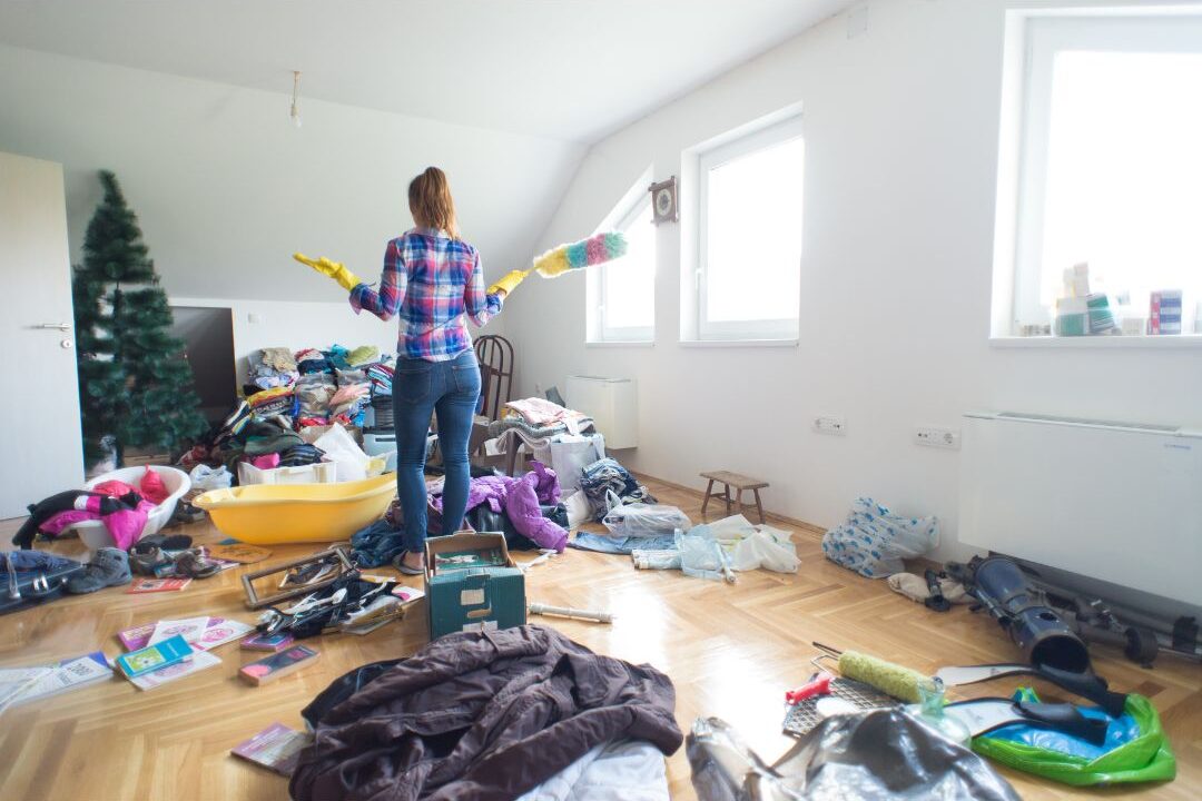 woman feeling overwhelmed before starting to tidy as a reason her house always feels messy