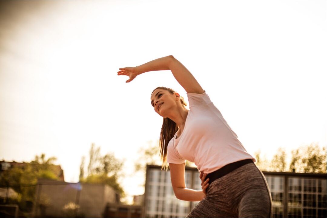 mom exercising outside as a free physical self care habit