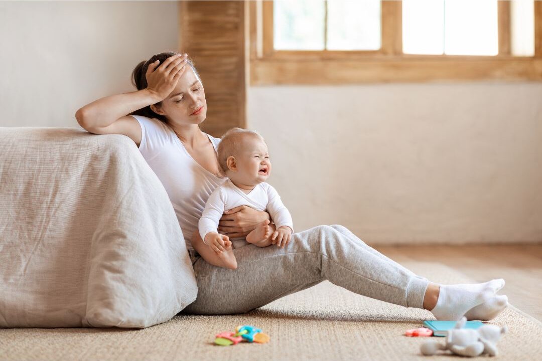 exhausted mother holding her baby in the morning navigating early parenthood