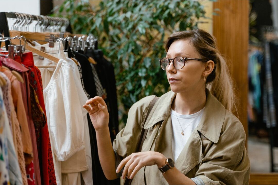 woman shopping secondhand as a smart way to build an elegant wardrobe affordably