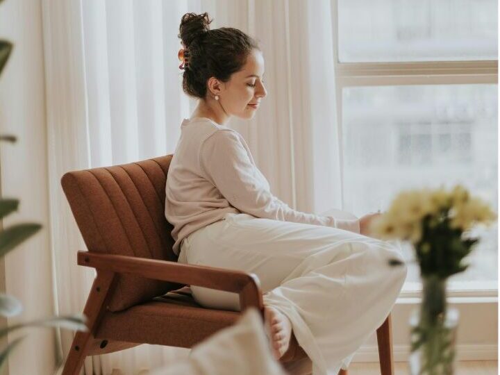 stay-at-home mom sitting by the window, enjoying her soft life which is not dependent on money