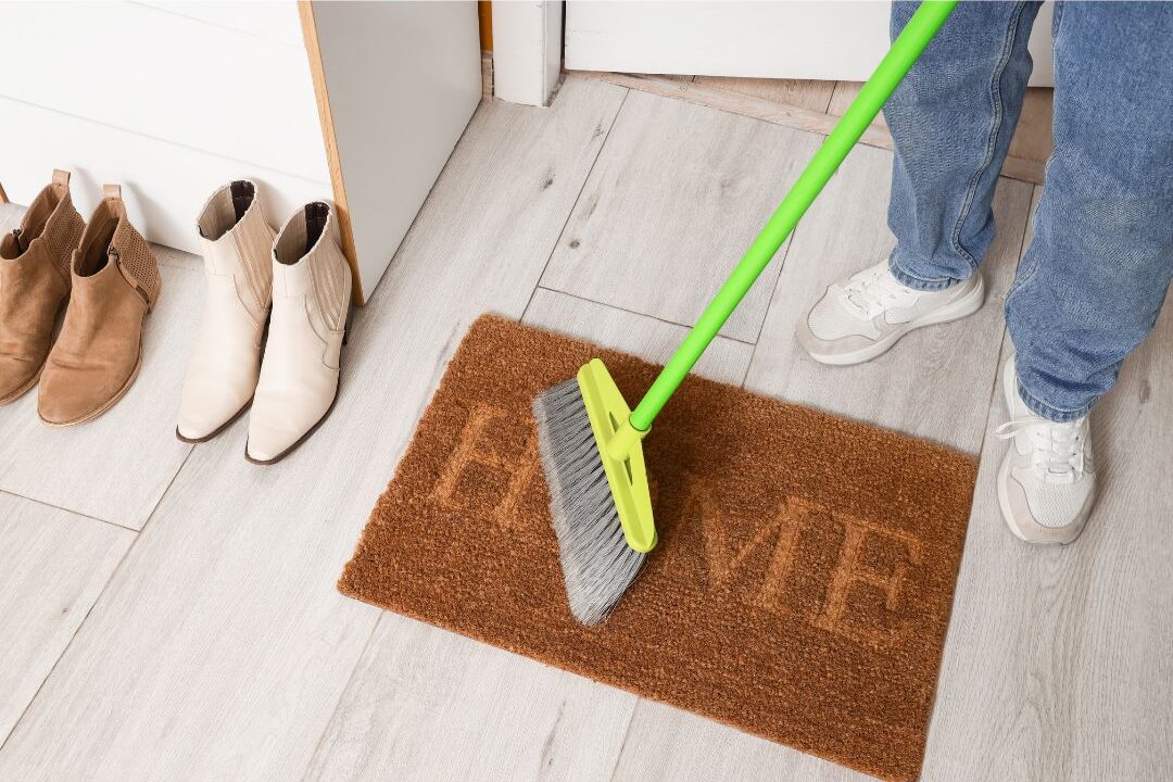 sweeping the entryway floor weekly to remove dirt