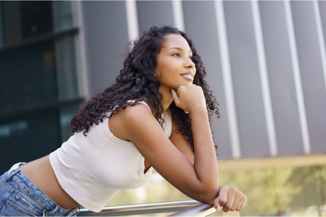 thoughtful woman reflecting outdoors in nature experiencing targeted restoration