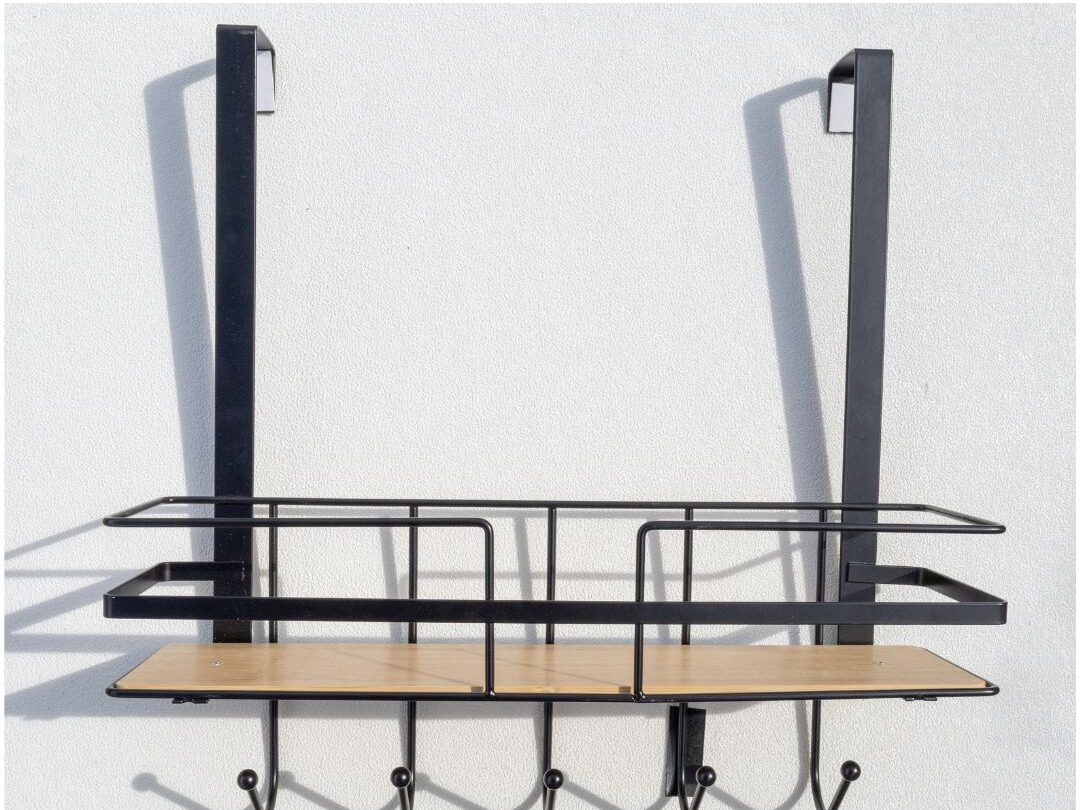 vertical tension rod organization next to a small desk setup