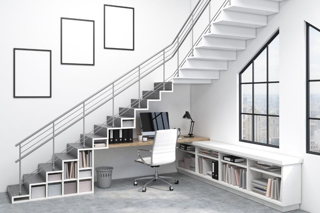 cozy under stairs desk setup with warm lighting for moms working from home