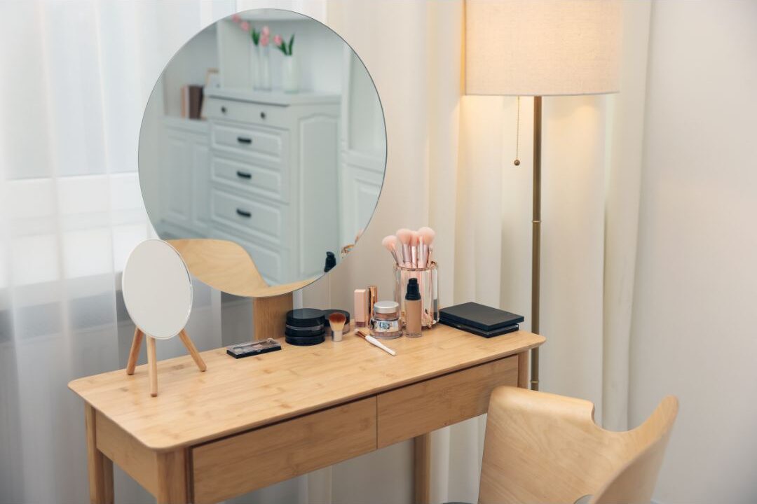 desk that doubles as a vanity in a small bedroom workspace setup