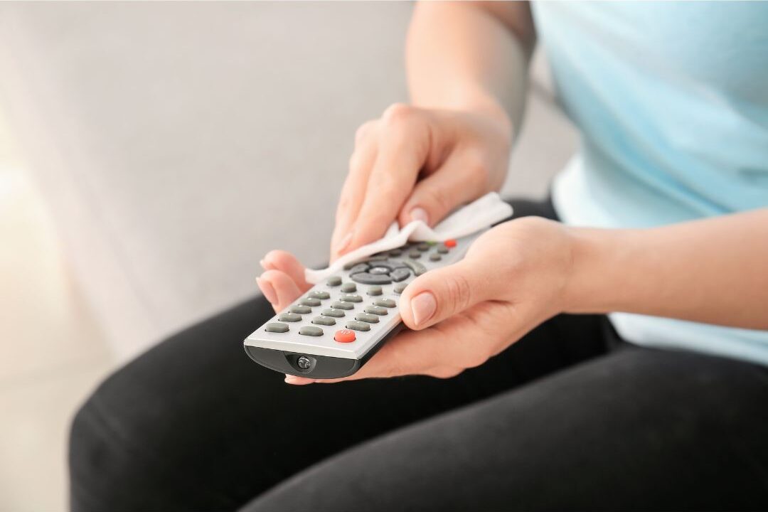 wiping down remote controls and living room surfaces