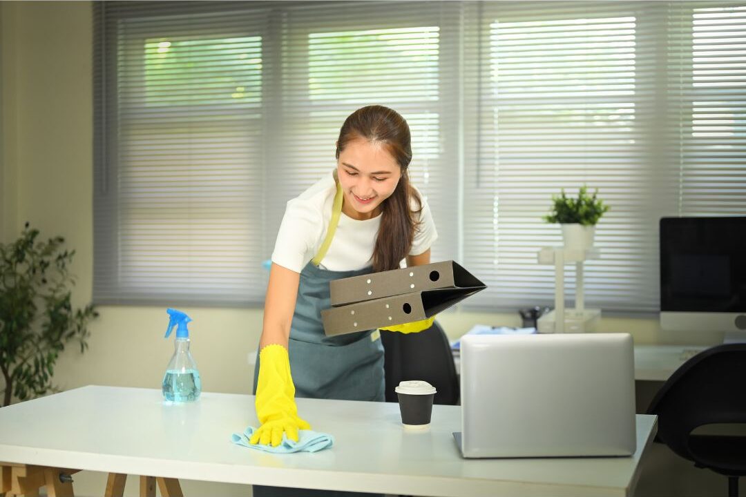 woman resetting her beautiful work from home space at the end of a session