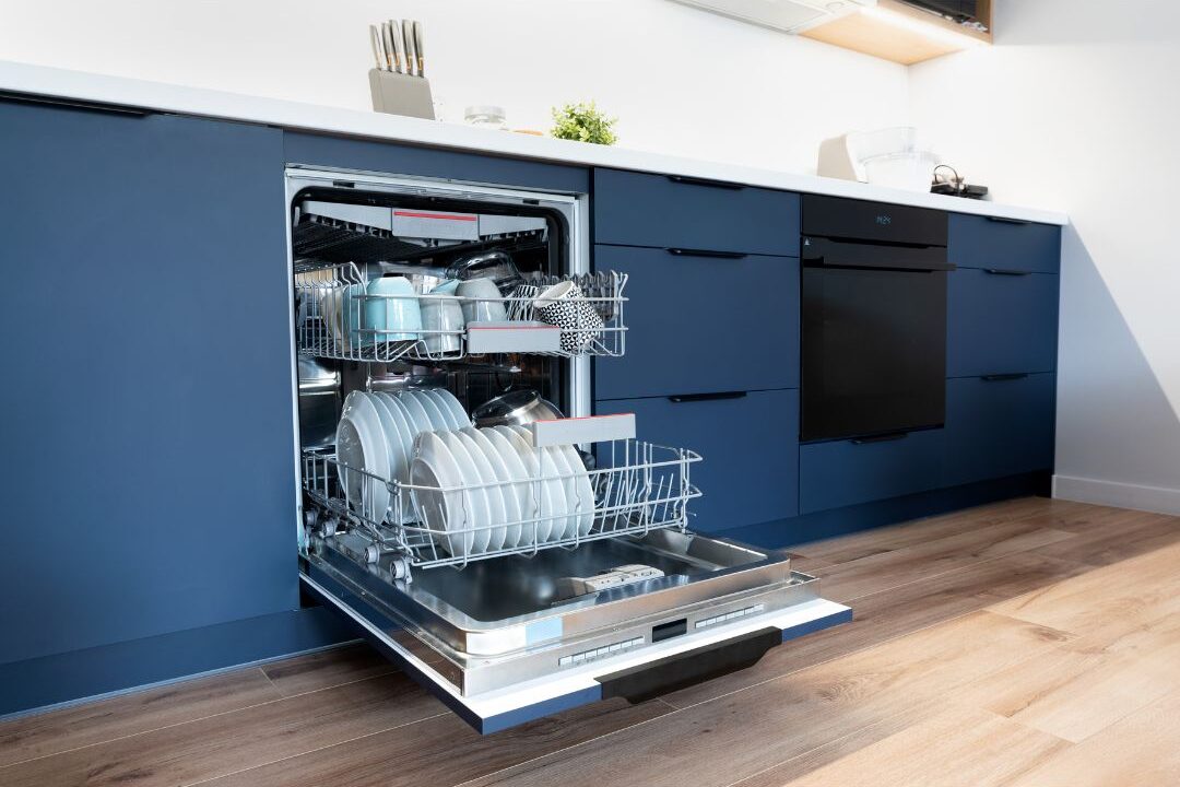 clean dishes inside open dishwasher in modern kitchen demonstrating daily kitchen automation
