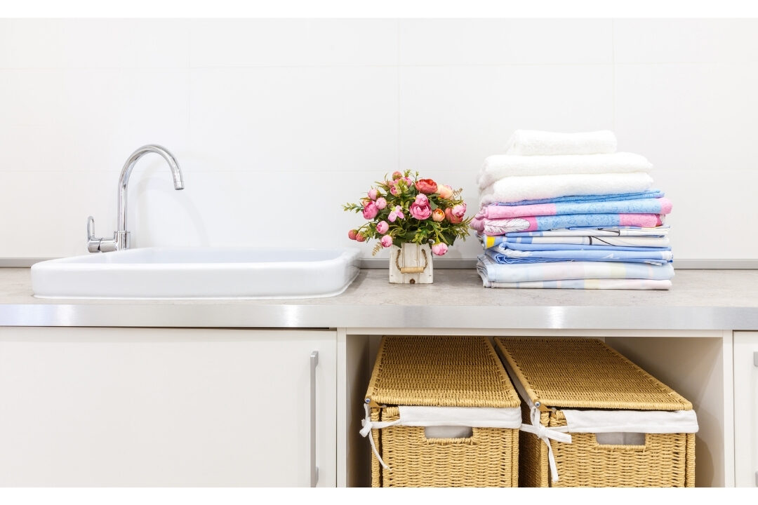 clean modern laundry room with organized woven baskets representing structured household routines