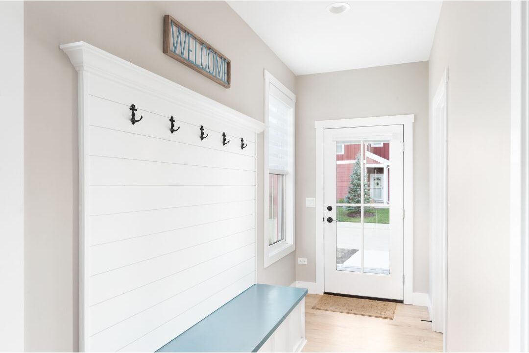 clean organized entryway with coat hooks and shoe bench showcasing peaceful batching systems