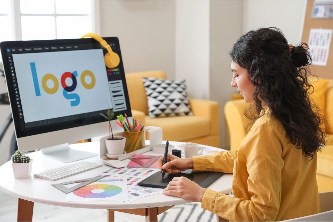 woman designing social media graphics on a computer screen creating canva templates
