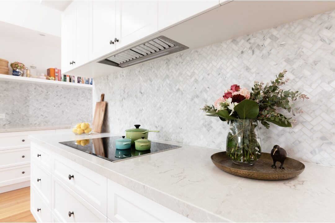 spotless kitchen island with flower vase showing clean surfaces