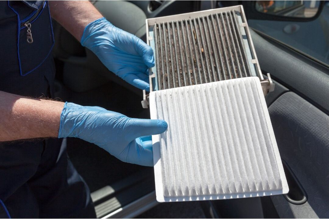 clean air filter held next to a dirty furnace filter illustrating home maintenance care