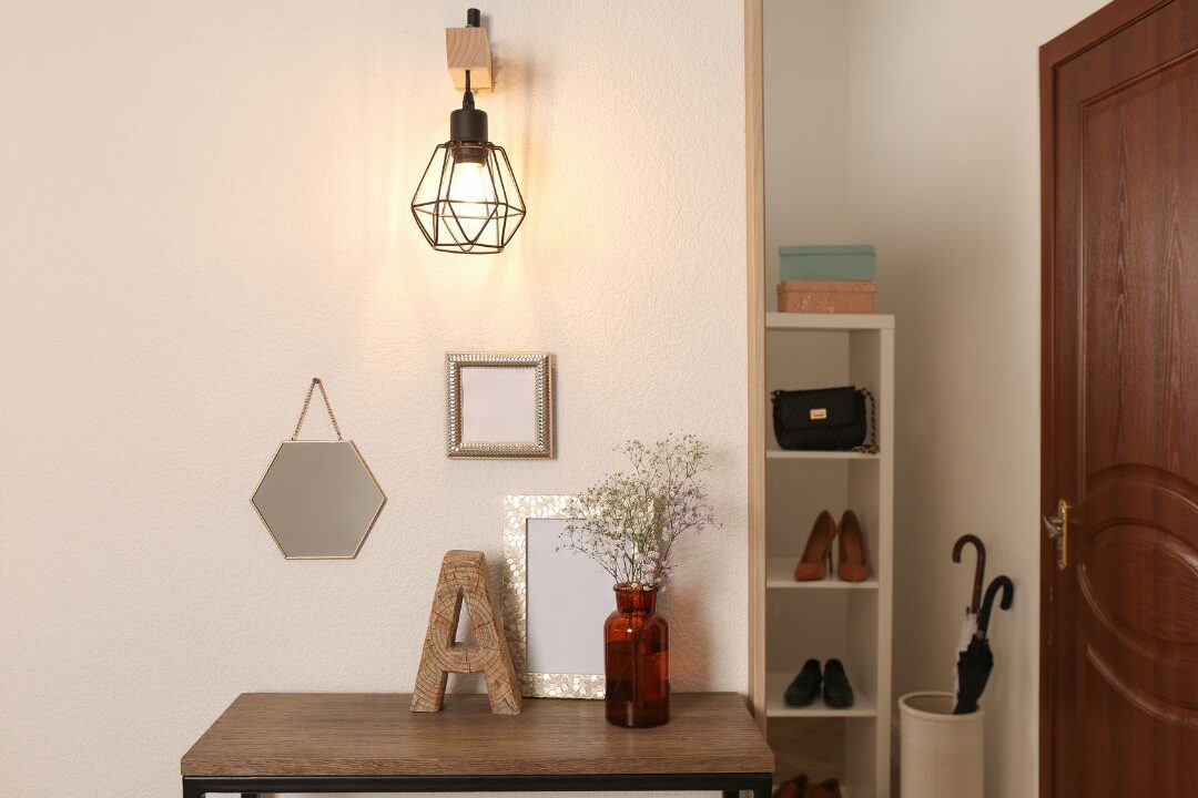 beautifully styled entryway console with closed storage basket and neutral art showing clean decor