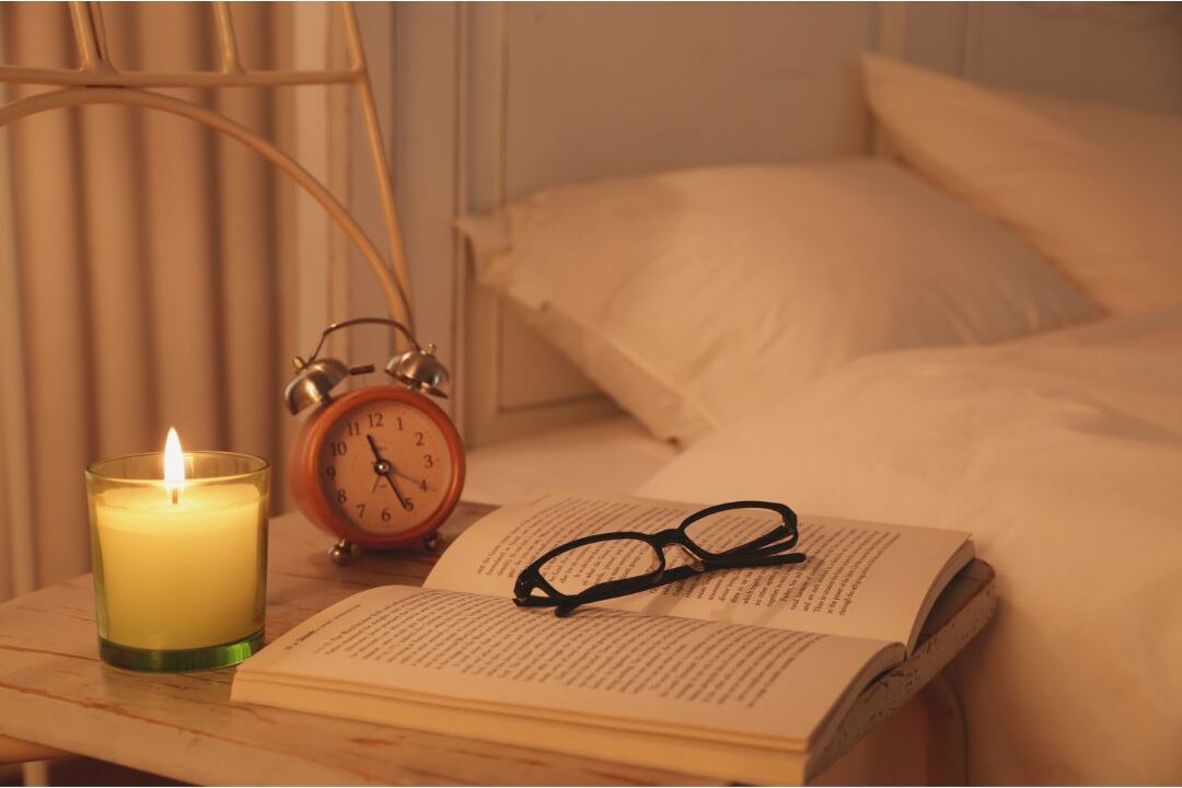 organized nightstand with lamp book and no digital devices creating peaceful bedroom environment