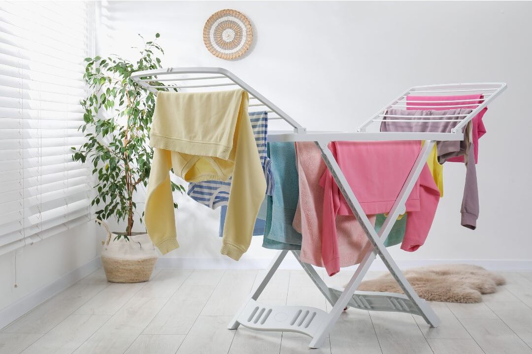 fresh clean laundry hanging on a rack indoors without using chemical fabric softeners