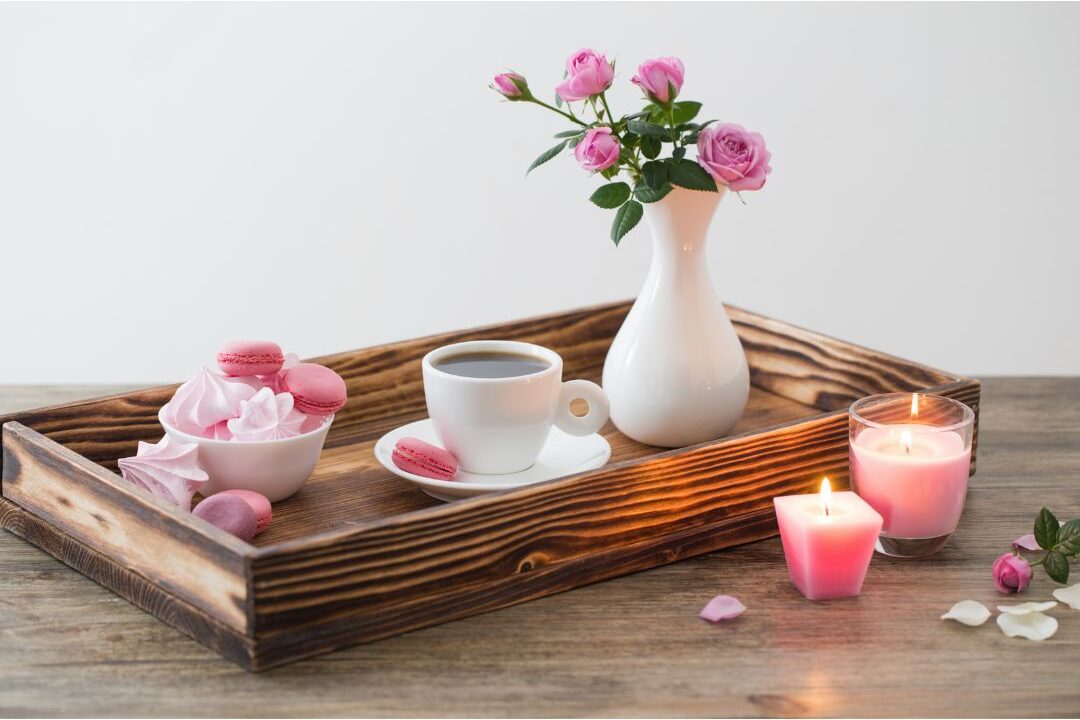 minimalist wooden tray with candle teapot and small flower vase comparing lifestyle habits