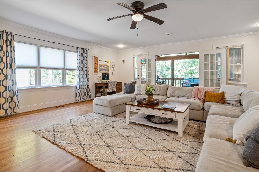 spacious living room layout with floating sofa and wide walkway showing proper spatial scale