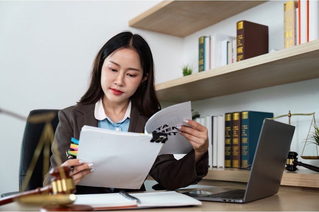 woman reviewing paperwork and phone contract details to stop rate increases