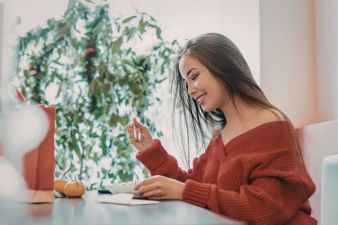 woman enjoying a quiet lunch at a sunny table without screens
