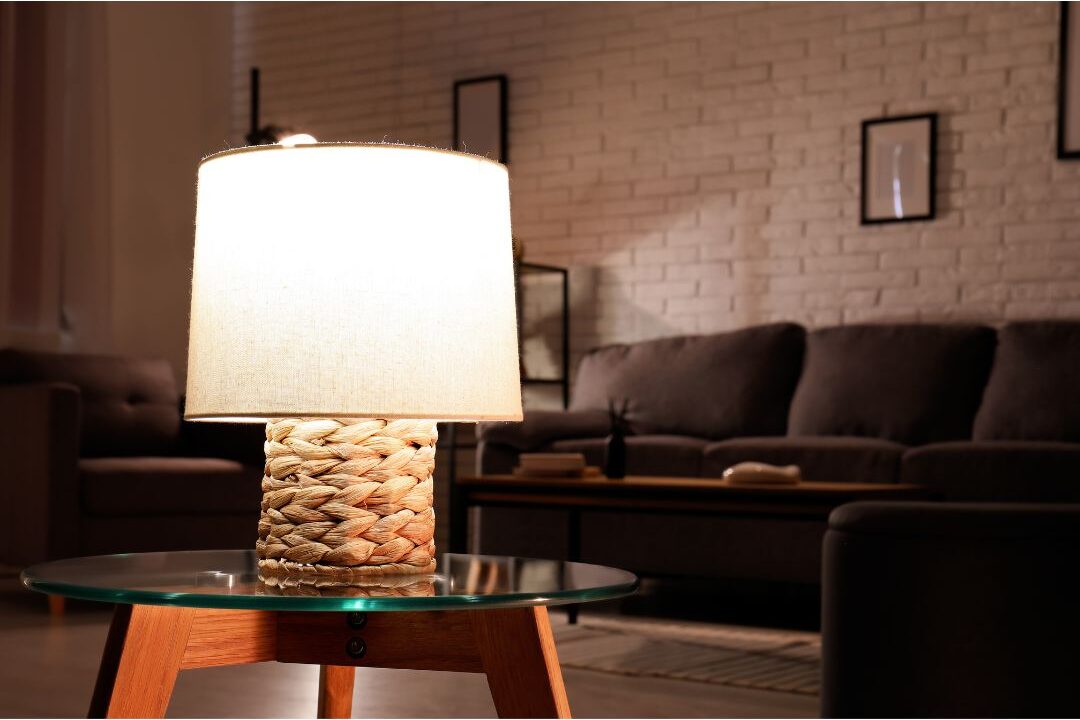 cozy evening room illuminated by warm table lamp on side table showing ambient lighting