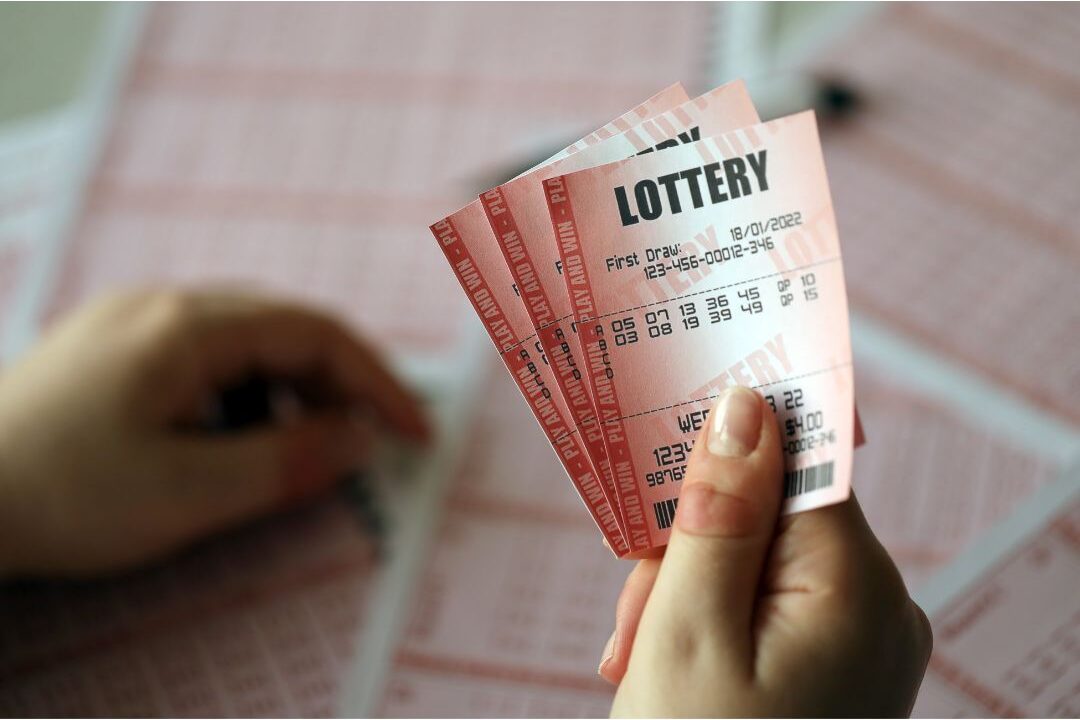 hand holding lottery tickets illustrating speculative financial choices