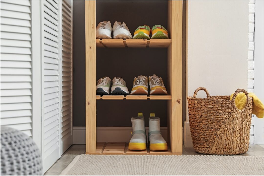 open wicker baskets and wooden entry bench holding shoes for easy put away