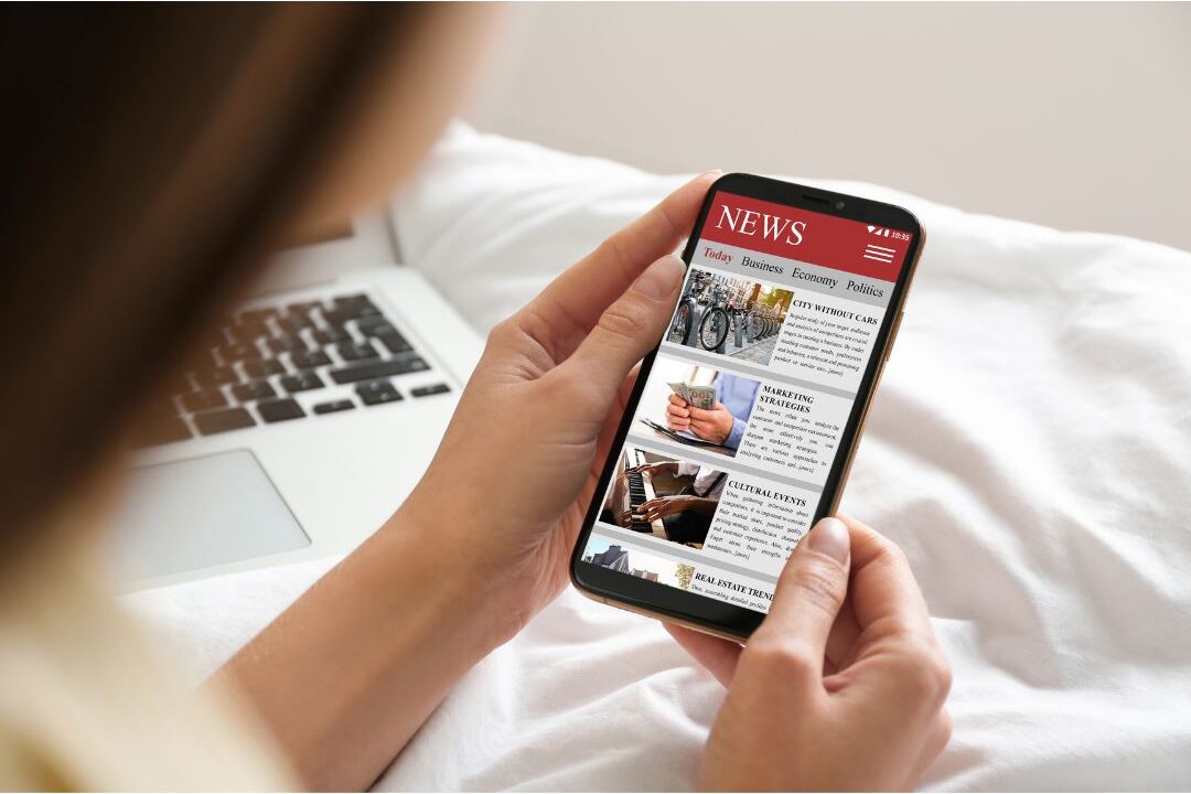 woman checking blog site design on a smartphone screen to avoid bad reader formatting