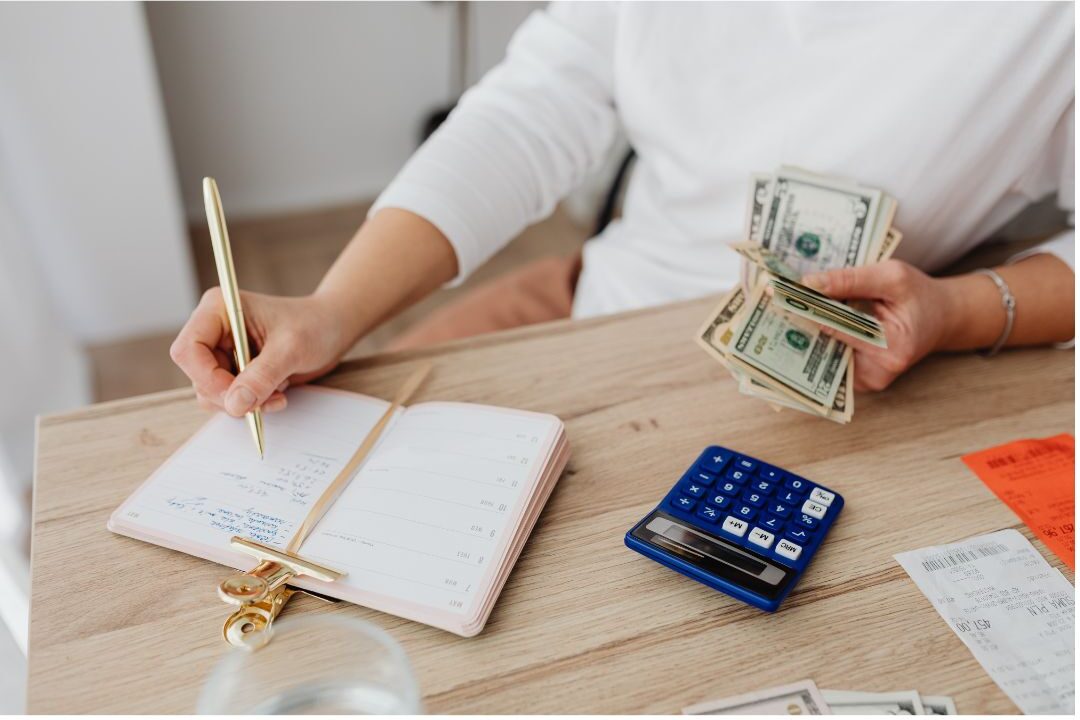 thoughtful woman reviewing household budget spreadsheets identifying money mistakes stay-at-home moms make