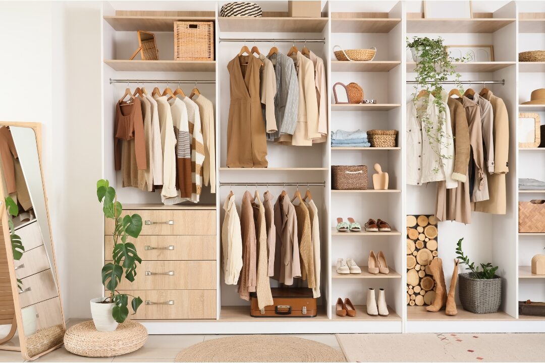 neatly organized coat closet with shoe racks and hanging baskets illustrating how to create a house that stays organized
