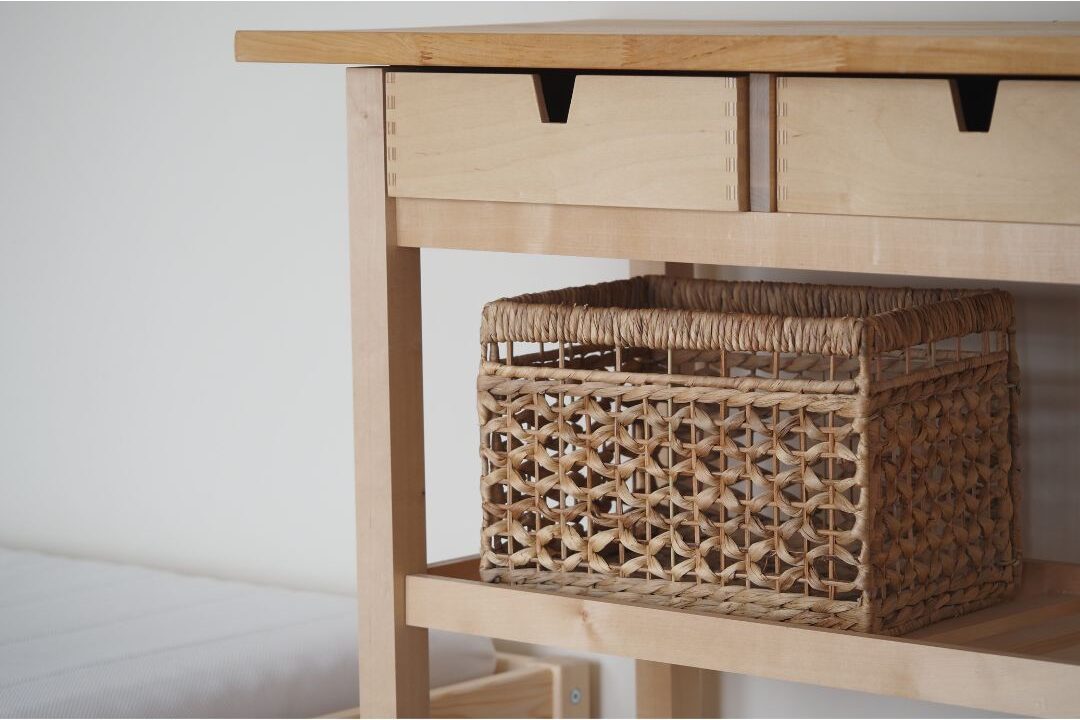 organized entryway console table with woven storage basket handling home returns