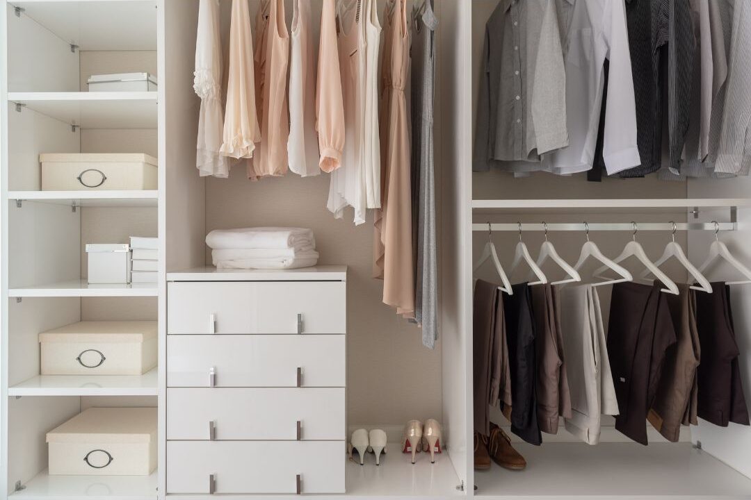minimalist closet with high quality plain clothing items reflecting quiet wealth choices